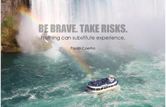 A boat filled with passengers navigates turbulent waters near waterfalls with a rainbow, accompanied by a quote about bravery and experience.