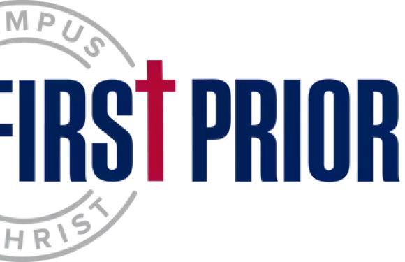 A logo featuring a large gear with the word "FIRST" inside, and the words "FIRST PRIORITY" to the right in bold blue font.