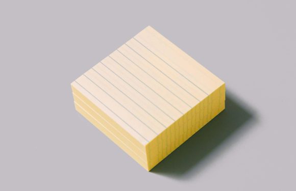 A stack of yellow lined notepads on a light gray background with a soft shadow.
