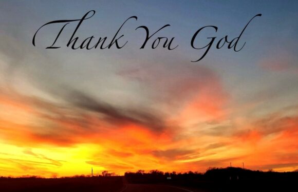 A sunset with vibrant orange, pink, and yellow clouds over a dark horizon, with the words "Thank You God" in elegant black script at the top.