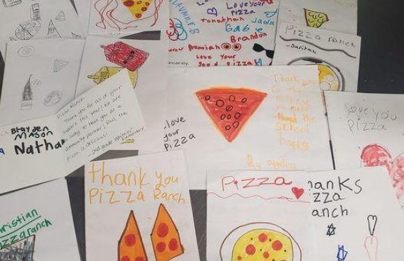 Collection of children's thank you notes and drawings for a pizza ranch, including pictures of pizza slices and heartfelt messages.