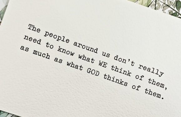 A handwritten quote on textured white paper that reads, "The people around us don’t really need to know what WE think of them, as much as what GOD thinks of them," placed on a floral patterned background.