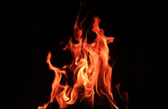 Bright orange flames against a dark background.