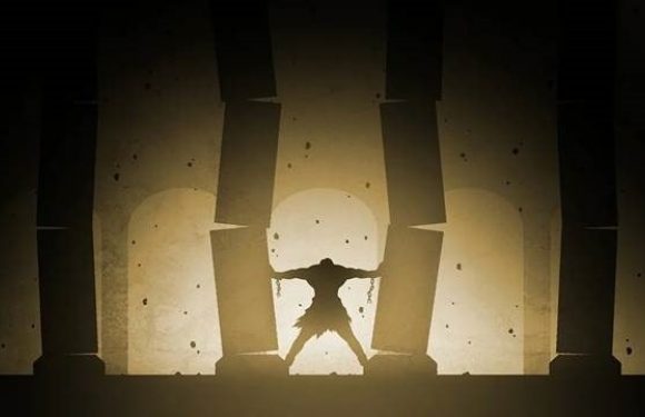 A person stands with arms outstretched between large stone columns, backlit against a bright, cloudy background creating a dramatic silhouette.