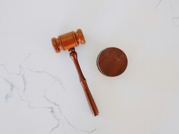 photo of a gavel resting on granite