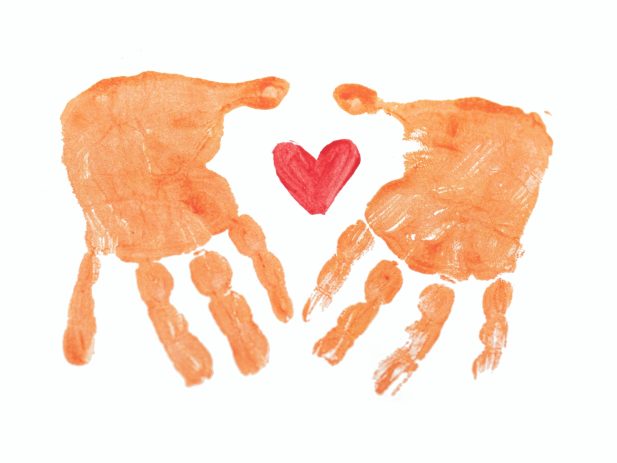 paint outline of 2 handprints with a heart in the middle