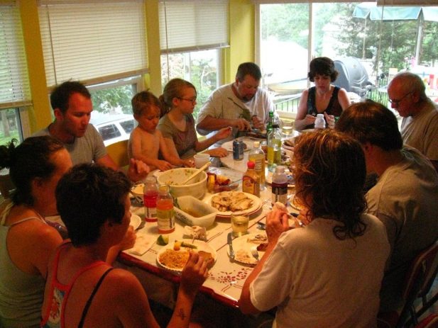 Family praying before a meal