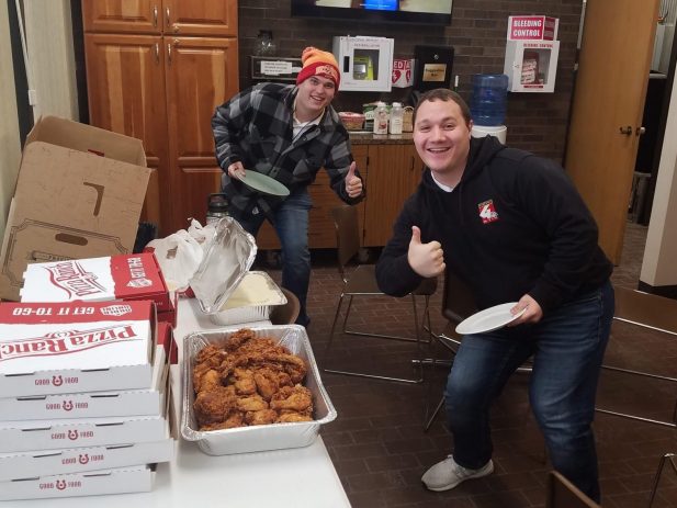 2 KTIV employees excited about having pizza, chicken and mashed potatoes