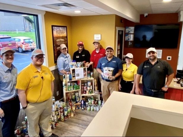 North Liberty Staff with Canned Good Donations
