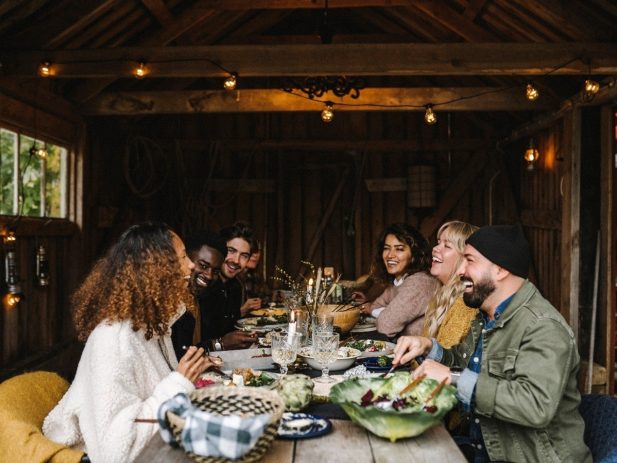 Friends gathered around a table sharing a meal.