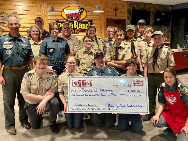 Photo of Pueblo Boy Scout Troup Posing with the Check showing how much they raised in a Fundraiser for Boy Scouts in Ukraine