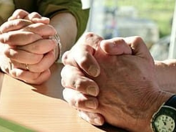Man and woman with Hands folded for prayer