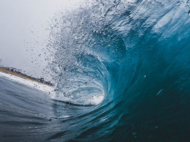 a photo appearing to be coming from inside a wave in the ocean