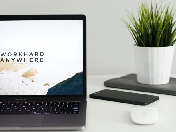 Laptop with image that says "Work hard anywhere"