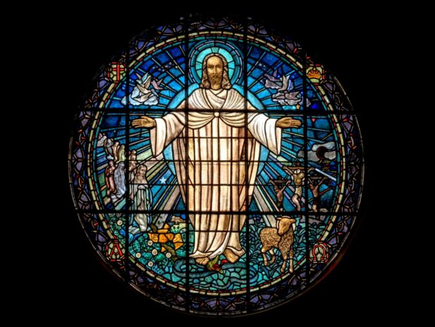 Stained glass window with Jesus in it.
