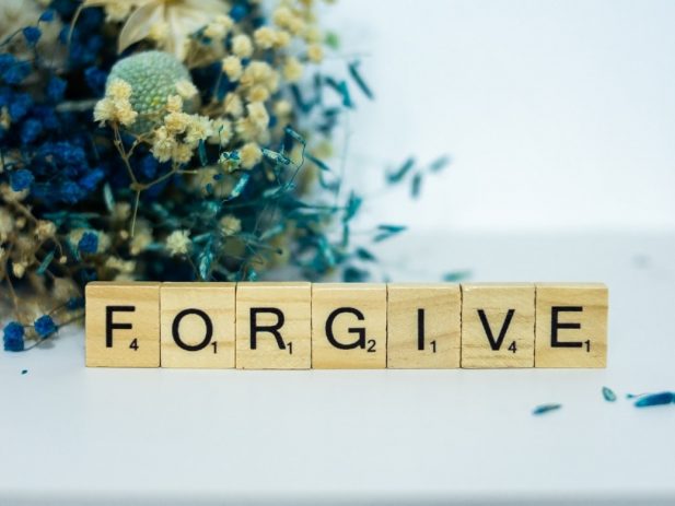Scrabble letters that say "FORGIVE"