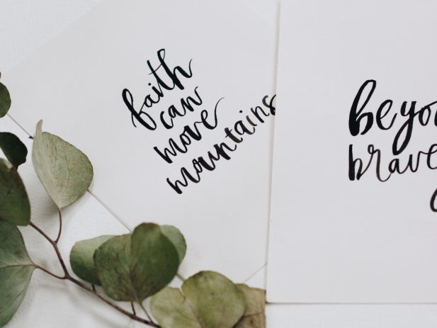 Note card that says "Faith can move mountains"