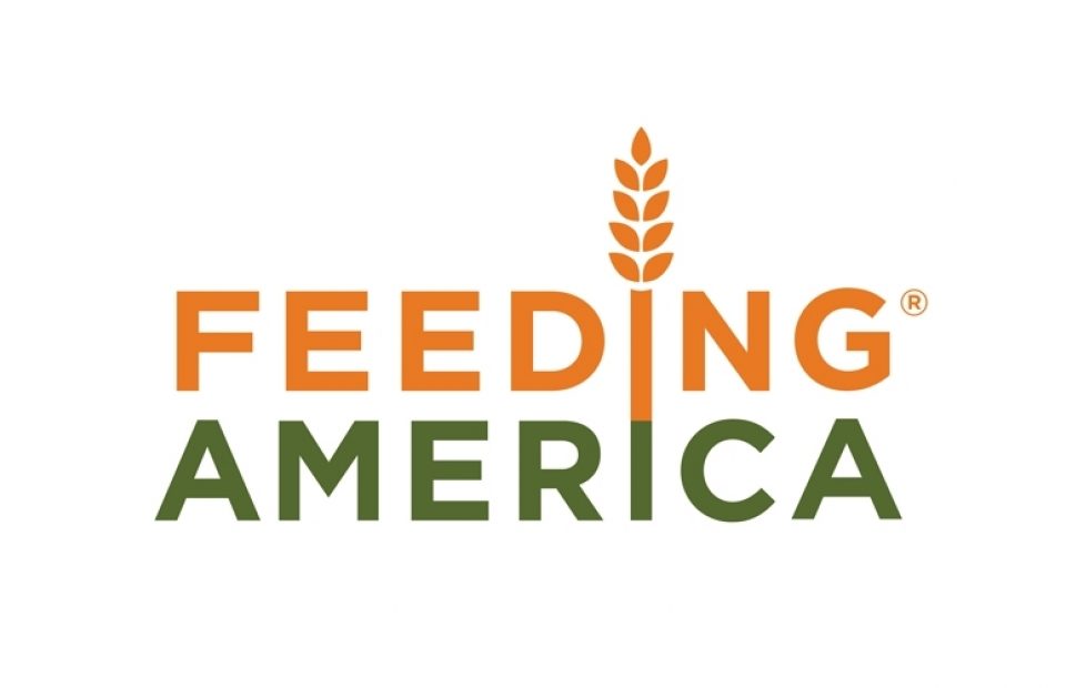 The logo features the words "FEEDING AMERICA" with a wheat stalk above the letter "I" in "FEEDING," and uses orange and green colors.