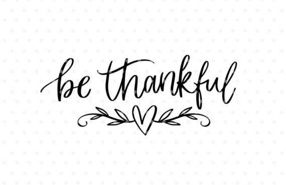 "Be thankful" written in elegant black script with a heart and leaf design beneath, on a white dotted background.