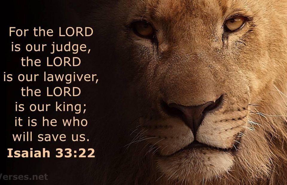 A close-up of a lion's face with a quote from Isaiah 33:22 overlaid: "For the LORD is our judge, the LORD is our lawgiver, the LORD is our king; it is he who will save us."