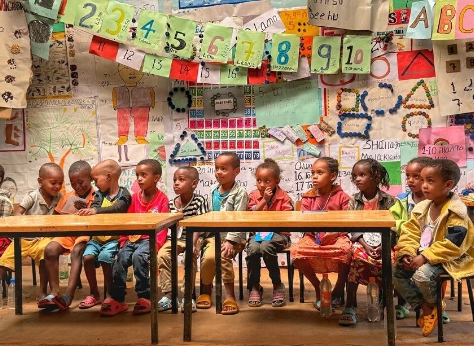 Azedebo Kindergarten Students in their classroom. Students at the kindergarten schools are taught the basics of an early childhood education. Beyond math, reading, science, and writing, students are also taught English, the local language, Kembaata, and Amharic, the national language of Ethiopia.