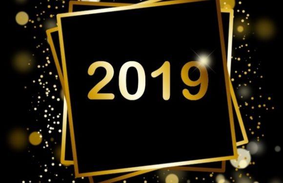 Black background with gold and white bokeh lights and sparkles, featuring overlapping black and gold framed squares with "2019" in gold at the center.