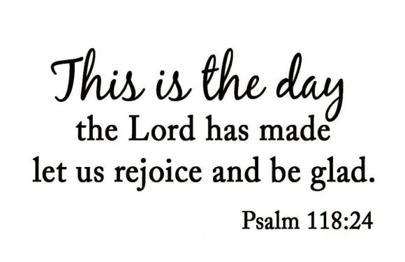 A quote from Psalm 118:24 in black cursive and serif font on a white background reads: "This is the day the Lord has made let us rejoice and be glad."