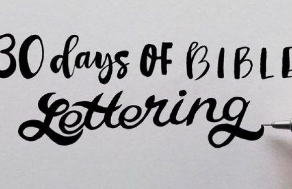 A hand holding a pen writes "30 days of Bible lettering" in black on a white background.