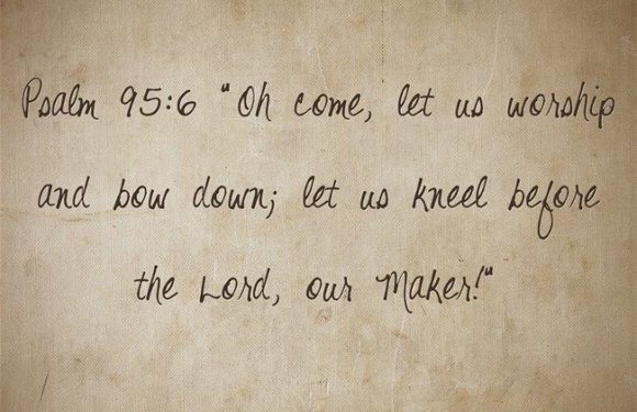 Handwritten quote on paper: "Psalm 95:6 'Oh come, let us worship and bow down; let us kneel before the Lord, our Maker.'"