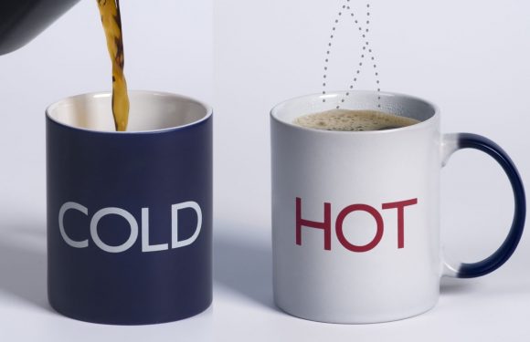 A mug labeled "COLD" is being filled with coffee, and another mug labeled "HOT" already contains hot coffee, with steam rising from it.