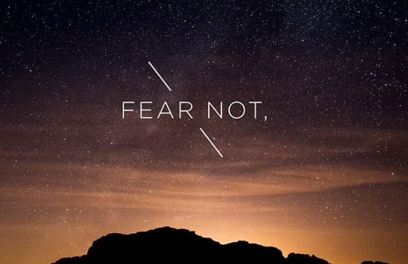 A night sky filled with stars over a silhouette of a mountain, with the words "FEAR NOT," and diagonal lines crossing through the text.