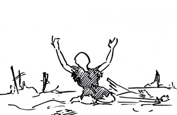 A person kneels on the ground with arms raised, wearing a uniform with a Pizza Ranch logo, amidst debris and broken wooden structures.