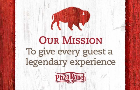 Red buffalo silhouette above the words "Our Mission" on a white wooden background, with the Pizza Ranch logo and the mission statement about providing a legendary experience.