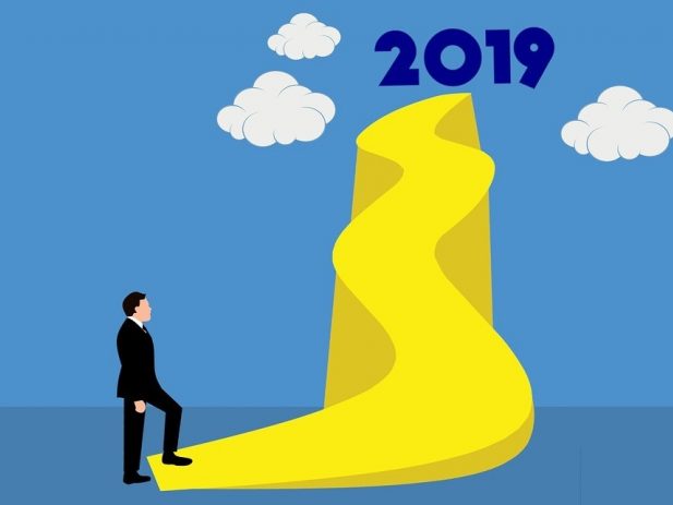 Long uphill sidewalk with 2019 at the top