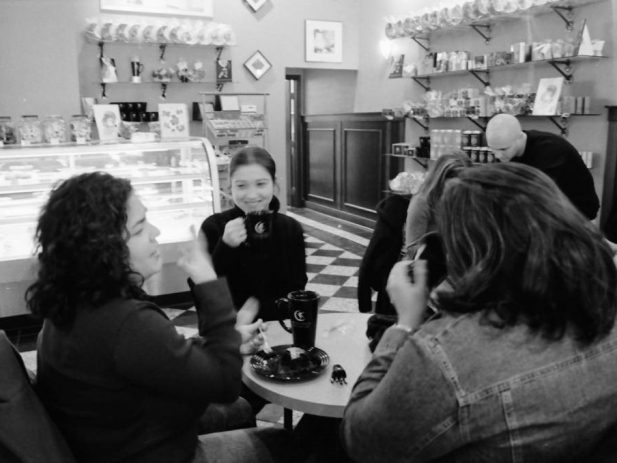 Friends have coffee in a cafe