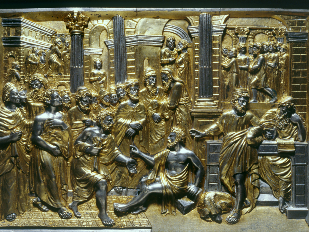 Carved gold image of bible story