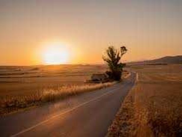 Sun rising over the road, new day and new path