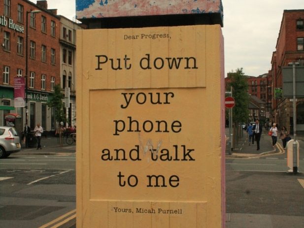 Sign saying "Put Down Your Phone"