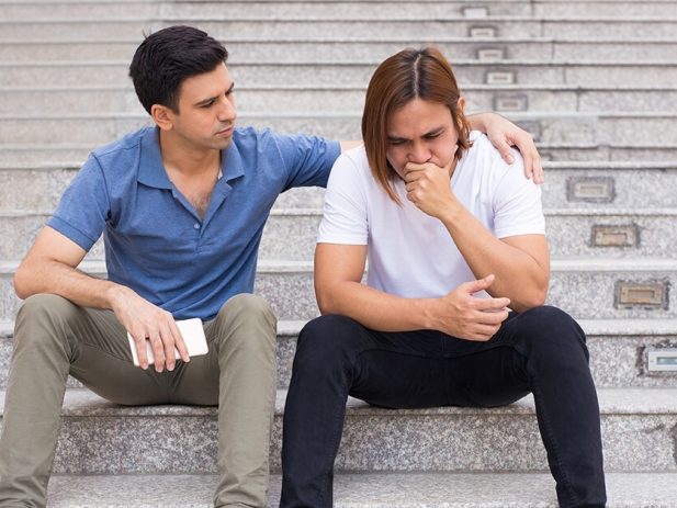 2 People Sitting on Steps, 1 supporting the other