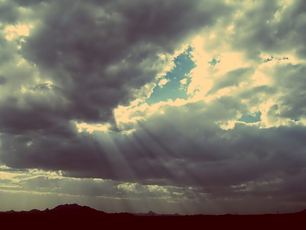 Sun beams shining through clouds
