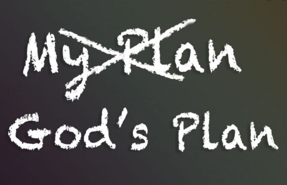 The words "My plan" and "God's plan" written in white chalk-like font on a dark chalkboard or blackboard background.