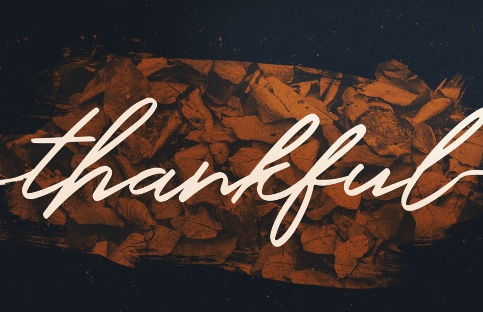 A thank you message in cursive white text overlays a background of stacked brown leaves.