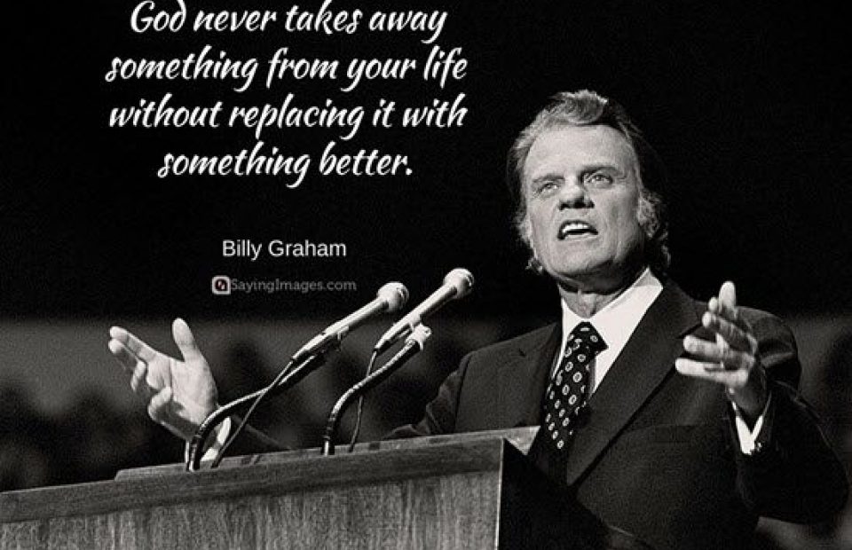 A man in a suit speaking at a podium with two microphones, gesturing with his hands, accompanied by a quote: "God never takes away something from your life without replacing it with something better."