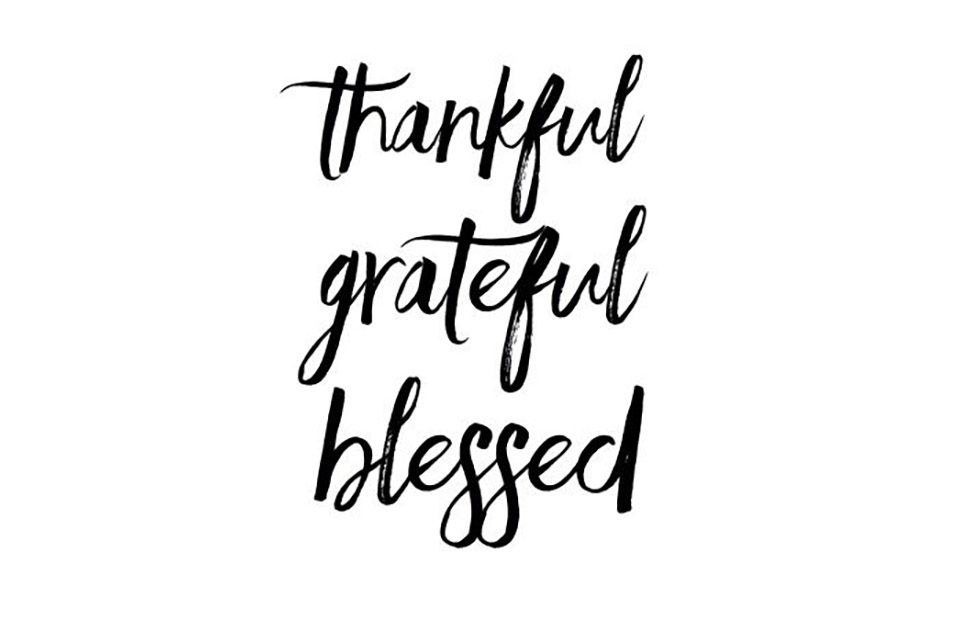 "Thankful, grateful, blessed" written in black cursive font on a white background.
